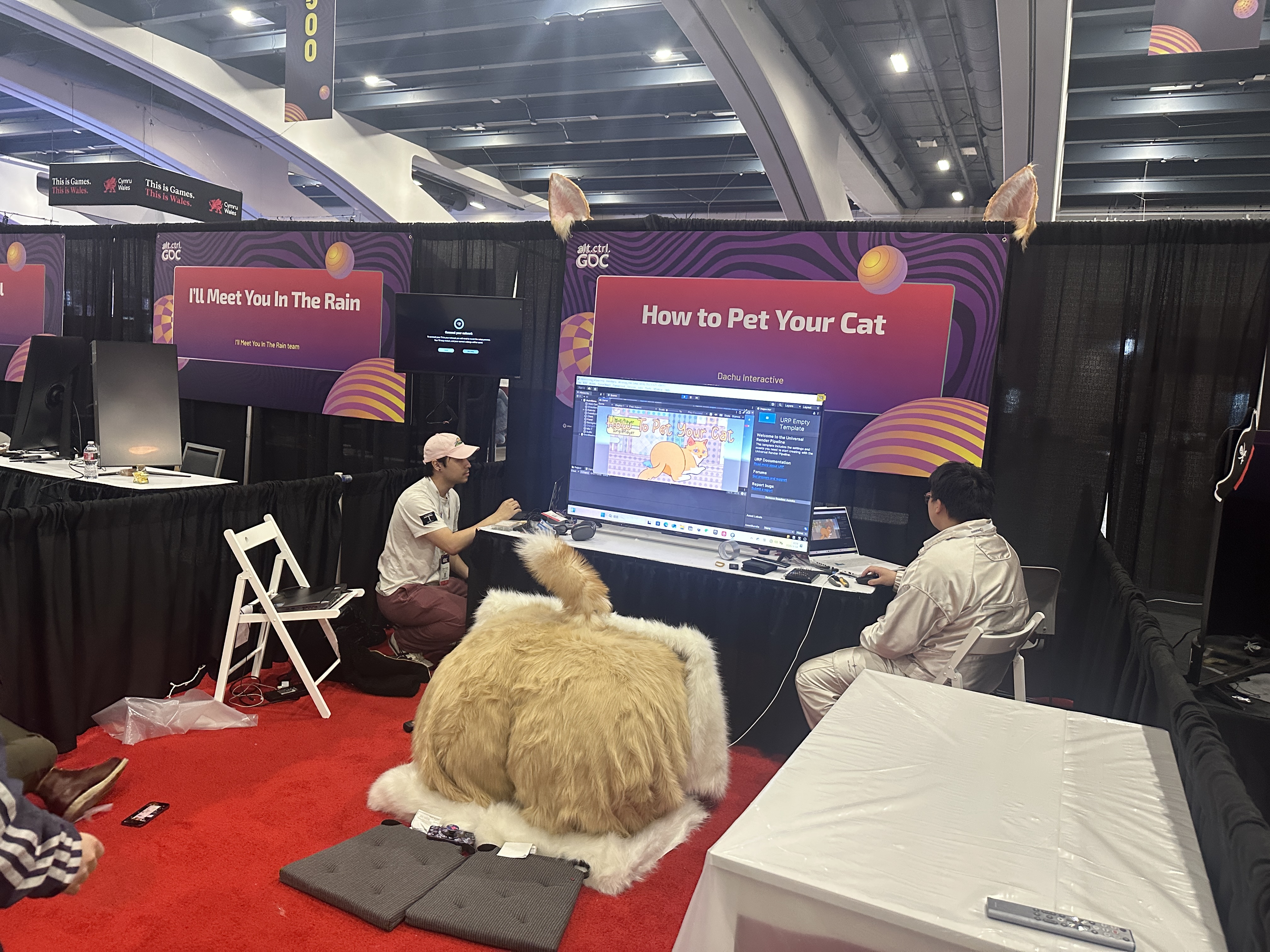 Setting up the How to Pet Your Cat booth at GDC